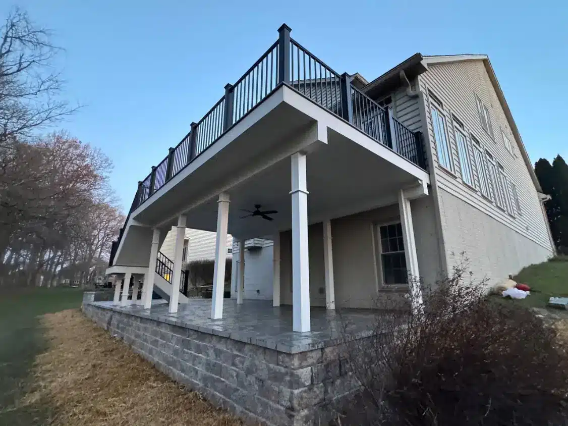 A spacious home featuring a large deck and porch, illustrating a potential project for porch contractors.